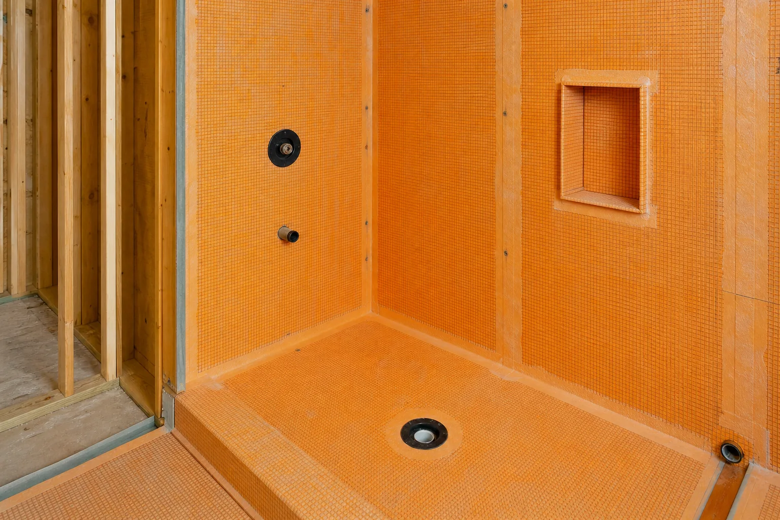 Waterproofing membrane installed behind a Cape Cod shower wall